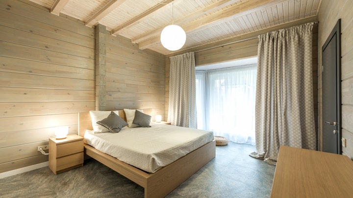 dormitorio-con-paredes-de-madera